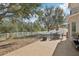 Great outdoor space with a large backyard, privacy fence, patio, and mature trees at 15701 Greyrock Dr, Spring Hill, FL 34610