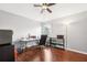 Bedroom features wood floors, a ceiling fan, and a window bringing in natural light at 15701 Greyrock Dr, Spring Hill, FL 34610