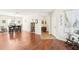 Inviting entryway with hardwood floors and a view of the dining room at 15701 Greyrock Dr, Spring Hill, FL 34610