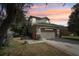 Attractive two-story home featuring a stone-accented front and a well-maintained lawn at 15701 Greyrock Dr, Spring Hill, FL 34610