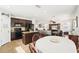 Open concept living: Kitchen with island flows into dining and living spaces, creating a spacious feel at 15701 Greyrock Dr, Spring Hill, FL 34610