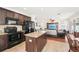 Open concept kitchen flows into dining and living spaces, creating a spacious and inclusive feel at 15701 Greyrock Dr, Spring Hill, FL 34610