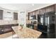 Beautiful kitchen with granite countertops, stainless steel appliances, and dark wood cabinets at 15701 Greyrock Dr, Spring Hill, FL 34610