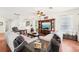 Spacious living room with hardwood floors and a large entertainment center at 15701 Greyrock Dr, Spring Hill, FL 34610