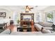 Cozy living room with hardwood floors and a large entertainment center at 15701 Greyrock Dr, Spring Hill, FL 34610
