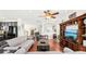 Open concept living room with hardwood floors and a comfortable seating area at 15701 Greyrock Dr, Spring Hill, FL 34610