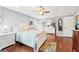 Bright main bedroom with a bed, wood floors, and a ceiling fan at 15701 Greyrock Dr, Spring Hill, FL 34610