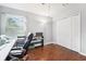Neutral office with wood floors, bright natural light, white closet and additional shelving at 15701 Greyrock Dr, Spring Hill, FL 34610