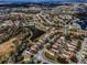 Wide aerial shot features a well-planned residential area with houses, ponds, and landscaped green spaces and solar panels at 19609 Timberbluff Dr, Land O Lakes, FL 34638