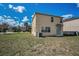 Home backyard view featuring a grass lawn with an air conditioning unit at 19609 Timberbluff Dr, Land O Lakes, FL 34638