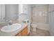 Bright bathroom featuring a vanity with a large sink and a tub and shower combination at 19609 Timberbluff Dr, Land O Lakes, FL 34638