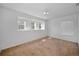 Empty bedroom with carpeted floor and bright windows allowing for great natural light at 19609 Timberbluff Dr, Land O Lakes, FL 34638
