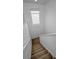 Carpeted staircase with white walls and railing leads to the upper or lower level of the home at 19609 Timberbluff Dr, Land O Lakes, FL 34638