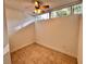 A room with tan tiles and a ceiling fan at 2401 Bayshore Blvd # 101, Tampa, FL 33629