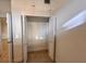 Bedroom closet with bi-fold doors and storage above in this condo at 2401 Bayshore Blvd # 101, Tampa, FL 33629