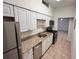 This compact kitchen offers white cabinets, granite countertops, and stainless steel appliances at 2401 Bayshore Blvd # 101, Tampa, FL 33629