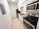 This compact kitchen provides the homeowner with stainless appliances at 2401 Bayshore Blvd # 101, Tampa, FL 33629