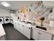 On-site laundry room offers multiple machines and a utility sink at 2401 Bayshore Blvd # 101, Tampa, FL 33629