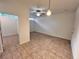 An empty room with adjacent room and ceiling fan at 2401 Bayshore Blvd # 101, Tampa, FL 33629