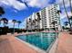 Inviting community pool surrounded by lounge chairs and lush landscaping at 2401 Bayshore Blvd # 101, Tampa, FL 33629