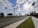 Street view showcasing the waterfront location, with views of the bay and the city skyline in the distance at 2401 Bayshore Blvd # 101, Tampa, FL 33629