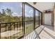 Enclosed balcony with sliding glass doors and black metal railing at 2700 Cove Cay Dr # 4-B, Clearwater, FL 33760
