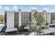 Multi-story building featuring balconies and covered parking at 2700 Cove Cay Dr # 4-B, Clearwater, FL 33760