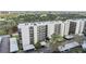 Spacious condo building with covered parking, lush landscaping, and numerous amenities at 2700 Cove Cay Dr # 4-B, Clearwater, FL 33760