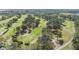 Scenic aerial view of the golf course with lush greenery and mature trees at 2700 Cove Cay Dr # 4-B, Clearwater, FL 33760