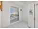 Bright kitchen area featuring a window for natural light and a modern refrigerator at 2700 Cove Cay Dr # 4-B, Clearwater, FL 33760