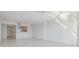 Bright living room featuring an open view to the kitchen and tile flooring at 2700 Cove Cay Dr # 4-B, Clearwater, FL 33760
