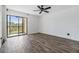 Bright living room with sliding doors to balcony and laminate flooring at 2700 Cove Cay Dr # 4-B, Clearwater, FL 33760
