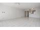 Spacious living room with tile floors, an open floor plan, and modern lighting at 2700 Cove Cay Dr # 4-B, Clearwater, FL 33760
