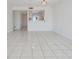 Bright living room featuring an open view to the kitchen and tile flooring at 2700 Cove Cay Dr # 4-B, Clearwater, FL 33760