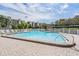 Community pool with pristine blue water and well-maintained deck at 2700 Cove Cay Dr # 4-B, Clearwater, FL 33760
