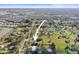 Aerial view of the property shows its location within the surrounding area and nearby lake at 3307 Fox Ridge Blvd, Wesley Chapel, FL 33543