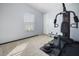 Bedroom featuring wall-to-wall carpet and space for a work out area at 3307 Fox Ridge Blvd, Wesley Chapel, FL 33543