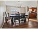 Elegant dining room with a chandelier and view of kitchen, great for entertaining at 3307 Fox Ridge Blvd, Wesley Chapel, FL 33543