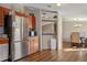 Spacious kitchen with stainless steel refrigerator and breakfast bar at 3307 Fox Ridge Blvd, Wesley Chapel, FL 33543
