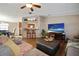 Open-concept living room with stylish furniture and a breakfast bar at 3307 Fox Ridge Blvd, Wesley Chapel, FL 33543