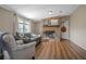Cozy living room featuring a stone fireplace and ample seating at 3307 Fox Ridge Blvd, Wesley Chapel, FL 33543