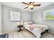 Cozy bedroom with hardwood floors, natural light, and ceiling fan at 349 Shirley Ave, Belleair, FL 33756