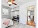 Bright bedroom with hardwood floors and a built-in desk area at 349 Shirley Ave, Belleair, FL 33756