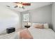 Cozy bedroom with hardwood floors, natural light, and a comfortable bed at 349 Shirley Ave, Belleair, FL 33756