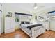 Cozy bedroom with hardwood floors, natural light, and white furniture at 349 Shirley Ave, Belleair, FL 33756