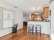 Cozy dining area adjacent to the kitchen with hardwood floors and seating for two at 349 Shirley Ave, Belleair, FL 33756