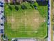 Overhead view of a green soccer field with clearly marked lines, goals, and surrounding greenery at 349 Shirley Ave, Belleair, FL 33756