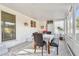 Bright sunroom featuring tile flooring, neutral walls, and updated windows, perfect for dining and relaxation at 349 Shirley Ave, Belleair, FL 33756