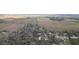Expansive aerial view of a rural property surrounded by fields and wooded areas at 36246 Peak St, Zephyrhills, FL 33541