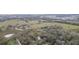 Lovely aerial perspective of a secluded house, complemented by ponds and open fields at 36246 Peak St, Zephyrhills, FL 33541